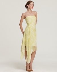 An enchanted evening begins with an airy Robert Rodriguez dress, light as a feather with a cascading handkerchief hem and and elegant gathering detail. An enchanted evening begins with an airy Robert Rodriguez dress, light as a feather with a cascading handkerchief hem and and elegant gathering detail.