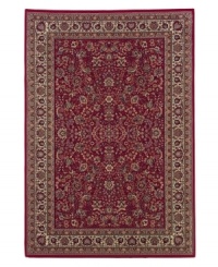 Inspired by the lovely Sarouk carpets of ancient Persia, this rug features an intricate floral motif in ivory, sage green and accents of soft blue against a rich red ground. Inspired by the lovely Sarouk carpets of ancient Persia, this rug features an intricate floral motif in ivory, sage green and accents of soft blue against a rich red ground.