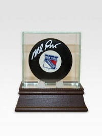 After a grueling 54 years without the Stanley Cup and seven stomach-churning finals games, the New York Rangers finally conquered the championship in 1994. As goaltender for the Rangers, Mike Richter's unwavering performance proved an essential part of the winning equation. Mike Richter has hand-signed this New York Rangers hockey puck and arrives in a glass/wood display case. Includes certificate of authenticity 8 X 8 X 8 Made in USA After a grueling 54 years without the Stanley Cup and seven stomach-churning finals games, the New York Rangers finally conquered the championship in 1994. As goaltender for the Rangers, Mike Richter's unwavering performance proved an essential part of the winning equation. Mike Richter has hand-signed this New York Rangers hockey puck and arrives in a glass/wood display case. Includes certificate of authenticity 8 X 8 X 8 Made in USA