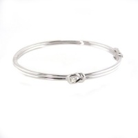 Everlon Sterling Silver Bangle Love Knot Bracelet with one 0.15 Carat Round Diamond Everlon Sterling Silver Bangle Love Knot Bracelet with one 0.15 Carat Round Diamond