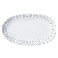 Handmade and inspired by the maestro artisan's family heirloom dinnerware, this white platter makes an elegant display for appetizers. Handmade and inspired by the maestro artisan's family heirloom dinnerware, this white platter makes an elegant display for appetizers.