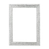 Bedazzled with hundreds of hand-set clear Swarovski® crystals in a silver-tone metal finish, this alluring frame glamorously displays your favorite photographs.