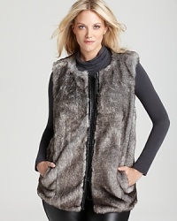 Talk about texture, sleek faux-leather trim interrupts the plush silhouette of this DKNYC Plus faux-fur vest for a roaring fashion statement. Talk about texture, sleek faux-leather trim interrupts the plush silhouette of this DKNYC Plus faux-fur vest for a roaring fashion statement.