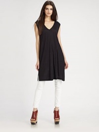 Urban-cool cap sleeves and side slits add a flirty edge to this lengthy jersey v-neck. V-neckCap sleevesSide slits at hemLonger length hits below the hips50% viscose/50% modalDry cleanImportedModel shown is 5'10 (177cm) wearing US size Small. Urban-cool cap sleeves and side slits add a flirty edge to this lengthy jersey v-neck. V-neckCap sleevesSide slits at hemLonger length hits below the hips50% viscose/50% modalDry cleanImportedModel shown is 5'10 (177cm) wearing US size Small.