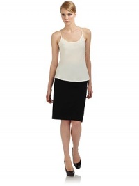 THE LOOKScoopneckThin spaghetti strapsGently ruffled hemV-backTHE FITAbout 25½ from shoulder to hemTHE MATERIALSilkCARE & ORIGINDry cleanMade in ItalyModel shown is 5'10½ (179cm) wearing US size 4. THE LOOKScoopneckThin spaghetti strapsGently ruffled hemV-backTHE FITAbout 25½ from shoulder to hemTHE MATERIALSilkCARE & ORIGINDry cleanMade in ItalyModel shown is 5'10½ (179cm) wearing US size 4.
