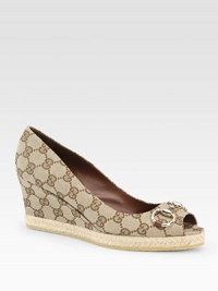 Signature GG fabric wedge with a rope-covered platform, peep toe and buckle adornment. Self-covered wedge, 3 (75mm)Rope-covered platform, 1 (25mm)Compares to a 2 heel (50mm)GG printed fabric upperLeather liningRubber solePadded insoleMade in ItalyOUR FIT MODEL RECOMMENDS ordering one half size up as this style runs small. Signature GG fabric wedge with a rope-covered platform, peep toe and buckle adornment. Self-covered wedge, 3 (75mm)Rope-covered platform, 1 (25mm)Compares to a 2 heel (50mm)GG printed fabric upperLeather liningRubber solePadded insoleMade in ItalyOUR FIT MODEL RECOMMENDS ordering one half size up as this style runs small.