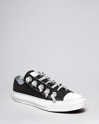 Stretchy sparkle laces make this cute slip on from Converse a comfy and stylish choice for her casual look. Stretchy sparkle laces make this cute slip on from Converse a comfy and stylish choice for her casual look.