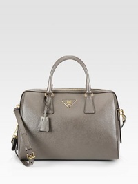 A roomy carryall with a structured frame in saffiano lux leather.Double top handles, 5 dropDetachable adjustable shoulder strap, 14½-17 dropTop zip closureProtective metal feetOne inside zip pocketOne inside open pocketSignature jacquard lining12¼W X 8½H X 6DMade in Italy A roomy carryall with a structured frame in saffiano lux leather.Double top handles, 5 dropDetachable adjustable shoulder strap, 14½-17 dropTop zip closureProtective metal feetOne inside zip pocketOne inside open pocketSignature jacquard lining12¼W X 8½H X 6DMade in Italy