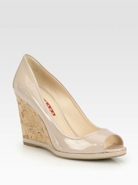Peep toe design with cork wedge and patent leather trim detail. Cork and patent leather wedge, 3½ (90mm)Patent leather upperLeather liningRubber solePadded insoleImportedOUR FIT MODEL RECOMMENDS ordering true size. Peep toe design with cork wedge and patent leather trim detail. Cork and patent leather wedge, 3½ (90mm)Patent leather upperLeather liningRubber solePadded insoleImportedOUR FIT MODEL RECOMMENDS ordering true size.