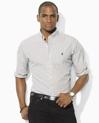 Tailored in a modern trim-fitting silhouette, a handsomely striped sport shirt is rendered in washed oxford-woven cotton for the look and feel of a well-worn wardrobe favorite. Tailored in a modern trim-fitting silhouette, a handsomely striped sport shirt is rendered in washed oxford-woven cotton for the look and feel of a well-worn wardrobe favorite.