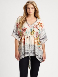 This delicate silk design features a lovely floral print. Your waist will be stylishly enhanced by its tasseled drawstring detail.V-neckElbow-length sleevesDrawstring waistSlash pocketsAbout 31 from shoulder to hemSilkHand washImported This delicate silk design features a lovely floral print. Your waist will be stylishly enhanced by its tasseled drawstring detail.V-neckElbow-length sleevesDrawstring waistSlash pocketsAbout 31 from shoulder to hemSilkHand washImported