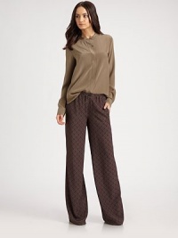 Front besom pockets, hidden button front and a hi-low hem add to the chic, oversized silhouette of this silk jewelneck blouse. JewelneckButton closureFront besom pocketsLong sleevesButtoned cuffsSilkDry cleanImportedModel shown is 5'10 (177cm) wearing US size 4. Front besom pockets, hidden button front and a hi-low hem add to the chic, oversized silhouette of this silk jewelneck blouse. JewelneckButton closureFront besom pocketsLong sleevesButtoned cuffsSilkDry cleanImportedModel shown is 5'10 (177cm) wearing US size 4.