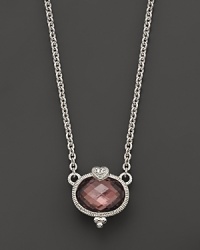 A faceted raspberry crystal oval is detailed with a sparkling white sapphire heart. From Judith Ripka. A faceted raspberry crystal oval is detailed with a sparkling white sapphire heart. From Judith Ripka.