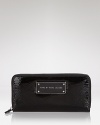 Practical accessories have a place in every it-girl's purse. But in a cool hue, this patent leather wallet from MARC BY MARC JACOBS is almost too chic to keep inside.