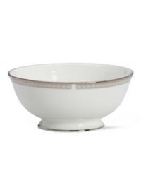 Metropolitan sensibility and modern design combine in this understated white bone china fruit bowl from Lenox's collection of dinnerware and dishes. Platinum gild along the edge is enhanced by a clean, platinum geometric pattern reminiscent of architectural accents. Metropolitan sensibility and modern design combine in this understated white bone china fruit bowl from Lenox's collection of dinnerware and dishes. Platinum gild along the edge is enhanced by a clean, platinum geometric pattern reminiscent of architectural accents.