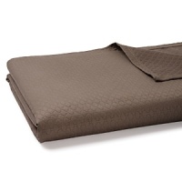 A delicate woven pattern of oval bands adorns this Calvin Klein coverlet, creating a gorgeously rich addition to your boudoir. A delicate woven pattern of oval bands adorns this Calvin Klein coverlet, creating a gorgeously rich addition to your boudoir.