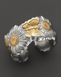 A butterfly and daisy design is detailed in 18K yellow gold accents on Buccellati's band ring. A butterfly and daisy design is detailed in 18K yellow gold accents on Buccellati's band ring.