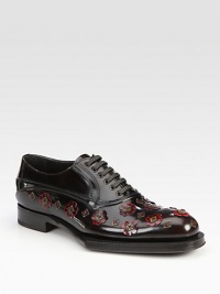 Leather lace-up style with 3D applique detail and exaggerated sole.Leather upperLeather liningWood/rubber soleMade in Italy Leather lace-up style with 3D applique detail and exaggerated sole.Leather upperLeather liningWood/rubber soleMade in Italy