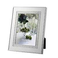 Vera Wang's Blanc Sur Blanc frame features a wide border of vivid silver plate that warmly complements treasured photographs. Vera Wang's Blanc Sur Blanc frame features a wide border of vivid silver plate that warmly complements treasured photographs.