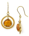 Textured gold and faceted citrine come together in Coralia Leets framed drop earrings. Rich 22K gold plating brings out the stone's natural beauty for goddess-like glamour.