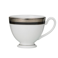 Intricately textured platinum rings on pure white china paired with the fashionably modern look of ebony creates a new sophistication for your table. Intricately textured platinum rings on pure white china paired with the fashionably modern look of ebony creates a new sophistication for your table.