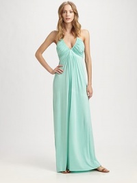 This gorgeously draped silhouette is both understated and dramatic.V-neckline Beaded halter ties Ruched bodice About 42 from natural waist Rayon/spandex; dry clean Made in USA This gorgeously draped silhouette is both understated and dramatic.V-neckline Beaded halter ties Ruched bodice About 42 from natural waist Rayon/spandex; dry clean Made in USA