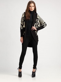 A bold and artful design of Southwestern motifs in a luxurious blend of wool, cashmere and silk with a long, contour shape.Wide, ribbed shawl collarOpen front with ribbed placketLong dolman sleeves with ribbed cuffsContour hemAbout 31 from shoulder to hemWool/silk/cashmereDry cleanImported of Italian yarnsSIZE & FITModel shown is 5'10 (177cm) wearing US size Small. A bold and artful design of Southwestern motifs in a luxurious blend of wool, cashmere and silk with a long, contour shape.Wide, ribbed shawl collarOpen front with ribbed placketLong dolman sleeves with ribbed cuffsContour hemAbout 31 from shoulder to hemWool/silk/cashmereDry cleanImported of Italian yarnsSIZE & FITModel shown is 5'10 (177cm) wearing US size Small.