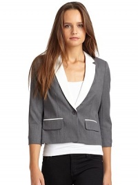 THE LOOKPadded shouldersNotched lapelButton closureDual flap pocketsCropped sleeves with button cuffsAsymmetric slit in backTHE FITAbout 20 from shoulder to hemTHE MATERIALBody: wool/polyesterCombo: triacetate/polyesterFully linedCARE & ORIGINDry cleanMade in USAModel shown is 5'11 (180cm) wearing US size 4. THE LOOKPadded shouldersNotched lapelButton closureDual flap pocketsCropped sleeves with button cuffsAsymmetric slit in backTHE FITAbout 20 from shoulder to hemTHE MATERIALBody: wool/polyesterCombo: triacetate/polyesterFully linedCARE & ORIGINDry cleanMade in USAModel shown is 5'11 (180cm) wearing US size 4.