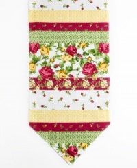 Kissed by a rose. Tiny buds, luscious blossoms and bright geometrics band together on the Rose Kiss table runner, featuring a machine washable blend to outfit your table with ease. Kissed by a rose. Tiny buds, luscious blossoms and bright geometrics band together on the Rose Kiss table runner, featuring a machine washable blend to outfit your table with ease.