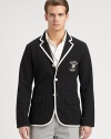 Preppy style meets luxurious comfort in this supremely lightweight cotton jersey blazer, finished with contrast piping and an embroidered crest for a heritage appeal.Button frontChest patch, waist flap pocketsRear ventAbout 29 from shoulder to hemCottonDry cleanImported