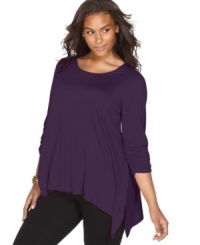 Enjoy the relaxed fit of NY Collection's three-quarter sleeve plus size top, finished by a handkerchief hem. Enjoy the relaxed fit of NY Collection's three-quarter sleeve plus size top, finished by a handkerchief hem.