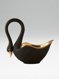 This graceful swan in black porcelain and 14kt gold accents is perfect for serving or decoration. Hand-gilded 7 edition: 3W X 7H X 6½D 13 edition: 6W X 13H X 13D Made in Portugal This graceful swan in black porcelain and 14kt gold accents is perfect for serving or decoration. Hand-gilded 7 edition: 3W X 7H X 6½D 13 edition: 6W X 13H X 13D Made in Portugal