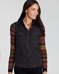 This Free People shirt features a cozy double-layered look with contrast sweater knit sleeves for warmth sans excess weight. This Free People shirt features a cozy double-layered look with contrast sweater knit sleeves for warmth sans excess weight.