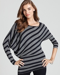 Asymmetrical stripes embrace a timeless trend and lend a modern edge to this tunic-style Bailey 44 top. Asymmetrical stripes embrace a timeless trend and lend a modern edge to this tunic-style Bailey 44 top.