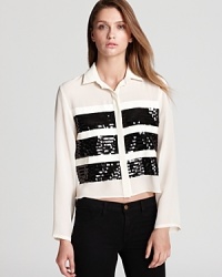 A modern take on cocktail attire, this Sachin + Babi blouse is embellished with stripes of sequins and grosgrain ribbon-a glam look that pairs with cropped LBPs for endless chic. A modern take on cocktail attire, this Sachin + Babi blouse is embellished with stripes of sequins and grosgrain ribbon-a glam look that pairs with cropped LBPs for endless chic.