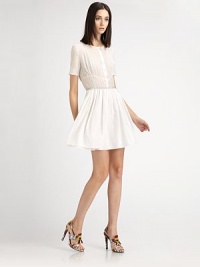 Airy, lightweight cotton voile, in a sweet, feminine silhouette accented with pintucks and a button front.Jewel necklineShort sleevesPintucked bodiceButton frontGrosgrain waistbandGathered skirtSelf liningAbout 17½ from natural waist70% cotton/30% silkDry cleanImported of Italian fabricModel shown is 5'11 (180cm) wearing US size 4. Airy, lightweight cotton voile, in a sweet, feminine silhouette accented with pintucks and a button front.Jewel necklineShort sleevesPintucked bodiceButton frontGrosgrain waistbandGathered skirtSelf liningAbout 17½ from natural waist70% cotton/30% silkDry cleanImported of Italian fabricModel shown is 5'11 (180cm) wearing US size 4.