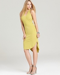 A bold, lemony hue pops on this Halston Heritage halter dress, cut in a sleek, minimalist silhouette. A bold, lemony hue pops on this Halston Heritage halter dress, cut in a sleek, minimalist silhouette.