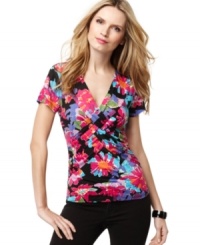 Cable & Gauge's classic twist-front top blooms with a bright floral print. The everyday low price makes it a perfect wardrobe-building staple! Cable & Gauge's classic twist-front top blooms with a bright floral print. The everyday low price makes it a perfect wardrobe-building staple!
