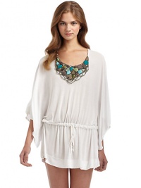 THE LOOKDolman sleeve pulloverScooped necklineBeaded bibDrawstring waistTHE FITAbout 33 from shoulder to hemTHE MATERIALRayonCARE & ORIGINDry cleanImportedTHE MATERIALLyocell/cotton/rayon/polyester/spandexCARE & ORIGINMachine washMade in USA of imported fabricModel shown is 5'8 (172½cm) wearing US size 4. THE LOOKDolman sleeve pulloverScooped necklineBeaded bibDrawstring waistTHE FITAbout 33 from shoulder to hemTHE MATERIALRayonCARE & ORIGINDry cleanImportedTHE MATERIALLyocell/cotton/rayon/polyester/spandexCARE & ORIGINMachine washMade in USA of imported fabricModel shown is 5'8 (172½cm) wearing US size 4.
