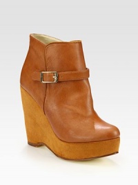 Step out in this elevated silhouette combining faux leather and faux suede, finished with a polished metal buckle. Faux suede wedge, 4¾ (120mm)Faux suede-covered platform, 1¼ (30mm)Compares to a 3½ heel (90mm)Faux leather upperFaux leather lining and solePadded insoleImportedOUR FIT MODEL RECOMMENDS ordering one half size up as this style runs small. Step out in this elevated silhouette combining faux leather and faux suede, finished with a polished metal buckle. Faux suede wedge, 4¾ (120mm)Faux suede-covered platform, 1¼ (30mm)Compares to a 3½ heel (90mm)Faux leather upperFaux leather lining and solePadded insoleImportedOUR FIT MODEL RECOMMENDS ordering one half size up as this style runs small.