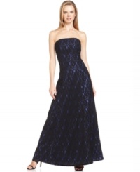 Calvin Klein's evening gown is classic and elegant with a strapless silhouette and a gorgeous lace overlay. Calvin Klein's evening gown is classic and elegant with a strapless silhouette and a gorgeous lace overlay.