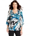 Alfani's top features stylish design touches like a cowl neckline, floral print and asymmetrical sleeves. (Clearance)