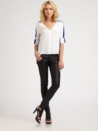 Bold colorblock trim elevates this tailored blouse styled in a slightly boxy silhouette.V-neckSlightly gathered shouldersCuffed sleevesTonal bindingHi-lo hemPolyesterDry cleanImportedModel shown is 5'9½ (176cm) wearing US size Small. Bold colorblock trim elevates this tailored blouse styled in a slightly boxy silhouette.V-neckSlightly gathered shouldersCuffed sleevesTonal bindingHi-lo hemPolyesterDry cleanImportedModel shown is 5'9½ (176cm) wearing US size Small.