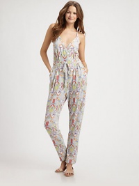 The quintessential balance of comfort and style, this stretch modal jumpsuit is a must-have swim coverup. Braided strapsFaux wrap frontFront pocketsAllover printDrawstring waist92% modal/8% spandexDry cleanMade in USA