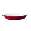 The Emile Henry classic oval gratin dish is shallow enough to spread a thin layer of food with a perfectly browned crust or topping. The handles make it easy to remove the dish from the oven with pot holders or oven gloves and is designed with shallow sloping sides, to ease out the cooked food.
