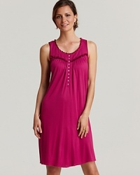 Sweet dreams start wtih this flowy short knit gown with ruffle trim and flower button accents. Sweet dreams start wtih this flowy short knit gown with ruffle trim and flower button accents.
