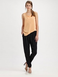 The simple elegance of woven silk, longer in length with a softly draped neckline.Draped necklineSleevelessPullover stylingShirttail hemAbout 29 from shoulder to hemSilkDry cleanImported The simple elegance of woven silk, longer in length with a softly draped neckline.Draped necklineSleevelessPullover stylingShirttail hemAbout 29 from shoulder to hemSilkDry cleanImported