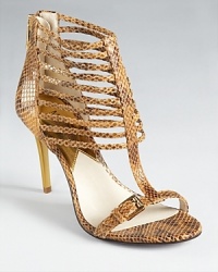 Go bold with MICHAEL Michael Kors' Molly sandals, a statement making shoe in snake embossed leather and a strappy silhouette. Go bold with MICHAEL Michael Kors' Molly sandals, a statement making shoe in snake embossed leather and a strappy silhouette.