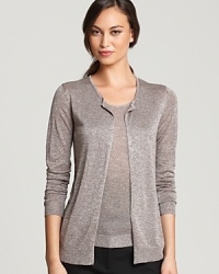 Subtle shimmer illuminates a classic Gerard Darel twinset for luxe sophistication. Slip on the sartorial stunner and ignite your everyday style. Subtle shimmer illuminates a classic Gerard Darel twinset for luxe sophistication. Slip on the sartorial stunner and ignite your everyday style.