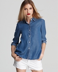 A MARC BY MARC JACOBS shirt infuses your wardrobe with a fresh denim look, crisp and clean with frayed white cut-offs and summer's de rigueur wedges. A MARC BY MARC JACOBS shirt infuses your wardrobe with a fresh denim look, crisp and clean with frayed white cut-offs and summer's de rigueur wedges.